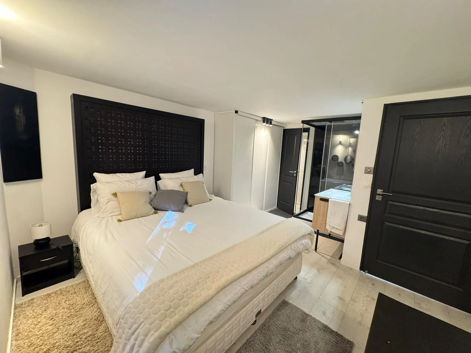 Bedroom with black headboard